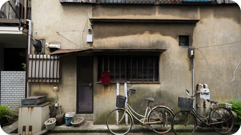 A traditional Chiang Mai shophouse with bicycles parked along the street